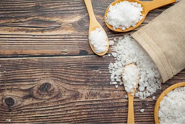 How does the food industry approach reducing salt in food?